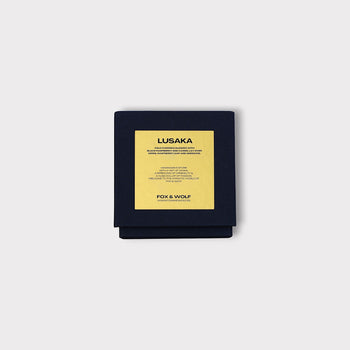 Vegan luxury Lusaka scented candle with dark spices and floral notes.