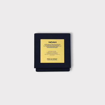  Vegan luxury Noah scented candle with warm tobacco, rum, and citrus notes.