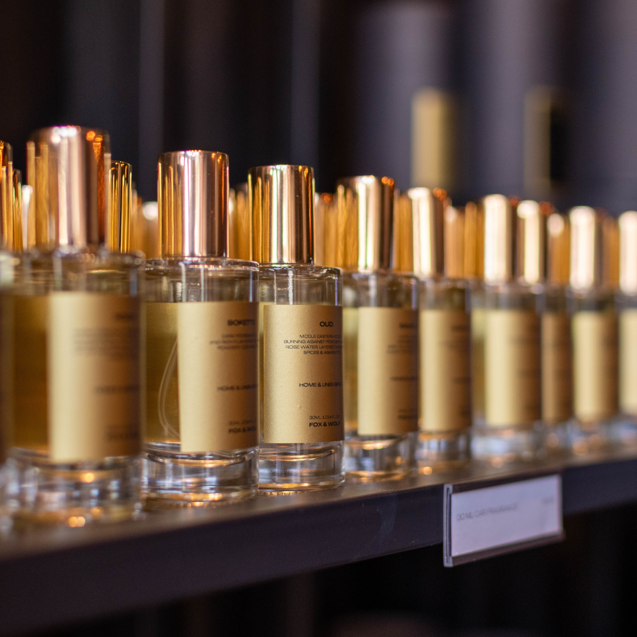 Close-up of FOX & WOLF car fragrance sprays displayed beautifully in the boutique.